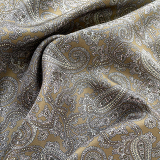 Close-up of taupe paisley silk neckerchief showing smooth twill texture.