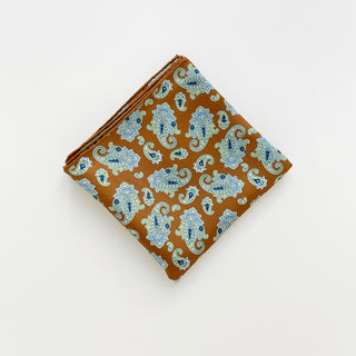 Folded honey brown paisley 65 cm men’s silk square scarf – double-sided print with hand-rolled edges