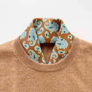 Honey brown paisley men’s silk scarf styled under camel sweater – vintage-inspired neckerchief look
