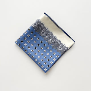 Folded cornflower blue vintage micro-motif silk scarf with lace-inspired border and hand-rolled edges by LuluLane