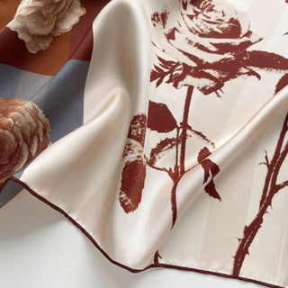 Close-up of Berlin Rose silk scarf – 65cm vintage floral square bandana in sepia tones with rust red hand-rolled hems by LuluLane