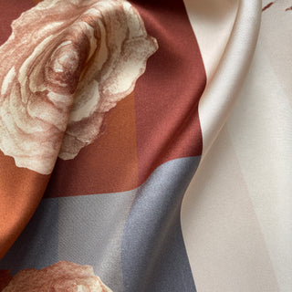 Close-up of Berlin Rose silk scarf – 65cm vintage floral square bandana in sepia tones by LuluLane