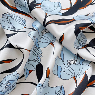 Close-up of a women’s silk bandana scarf 53cm with tulip floral print, double-sided satin square by LuluLane