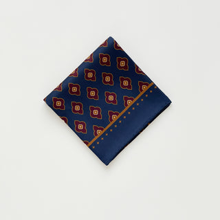 Folded men’s paisley silk scarf 65cm in navy blue, double-sided silk twill square with hand-rolled hems by LuluLane