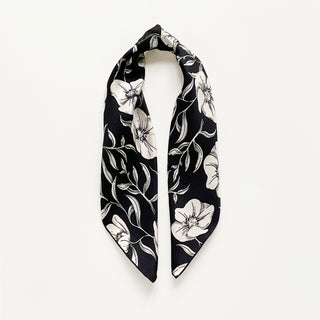 Women’s 65cm silk square scarf with off white poppy blossom floral print in black background, double-sided silk twill and hand-rolled hems by LuluLane