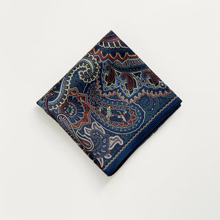 Folded navy blue men's neckerchief with intricate burgundy paisley pattern