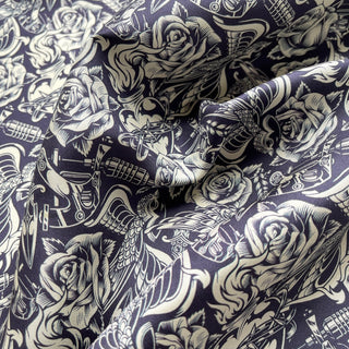 Close-up of Retro rose silk scarf neckerchief in navy blue and ivory with vintage floral and swallow print and mustard yellow hand-rolled edges