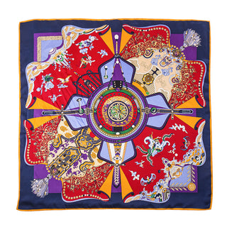 Luxury silk scarf with vibrant red, navy, purple and gold ornate pattern featuring a decorative medallion centerpiece with vintage-inspired motifs