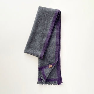 Heather grey and purple unisex cashmere scarf arranged to show its long, softly draped shape.