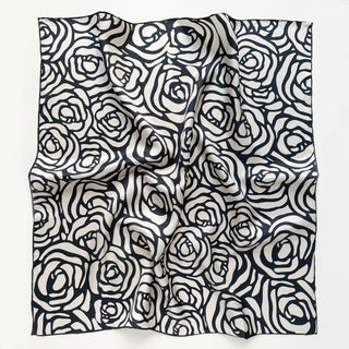 women's silk square scarf with charcoal black abstract rose pattern on cream white background with hand-rolled edges.