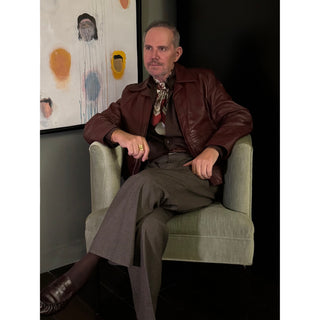 Man wearing brown leather jacket and paisley patterned burgundy silk neckerchief scarf – men’s silk scarf by LuluLane.