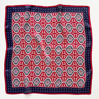 Luxurious square silk scarf with geometric hexagonal floral pattern in vibrant red, navy blue border with white dots, unisex 53cm bandana