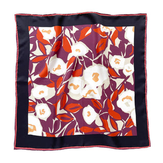 Luxurious silk scarf with burgundy purple background, white berry blossoms, and vibrant red leaves, framed by navy border with coral trim