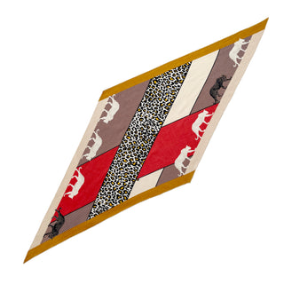 Diamond-shaped cashmere silk scarf with red, beige and mustard colors featuring leopard print pattern and white leopard silhouettes on striped background