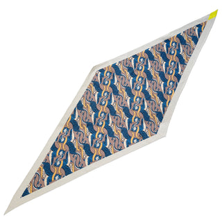 Diamond-shaped cashmere silk scarf featuring blue and beige tiger pattern with gold accents and cream border, highlighted by yellow corner accent