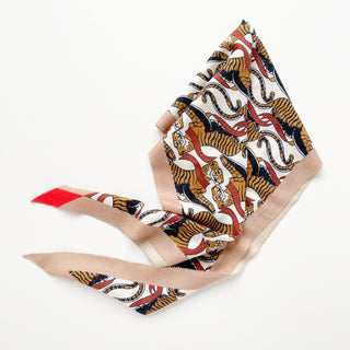 Cashmere silk scarf with vibrant tiger pattern in earth tones of beige, brown, black and orange-red with elegant beige border