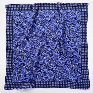 Navy blue silk neckerchief with intricate paisley pattern, featuring hand-rolled edges and floral border design on luxurious twill fabric