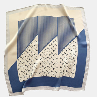 Square silk scarf with Lunar Peaks design featuring French blue and cream colors with geometric mountain pattern and subtle crescent moon details