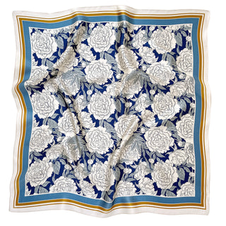 Luxury 65cm silk square scarf featuring white peony blooms on navy blue background with light blue and gold border trim