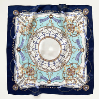 Turquoise & Navy Baroque Bridle Silk Scarf featuring intricate equestrian-inspired design with ornamental chains, buckles, and floral motifs on 100% silk.