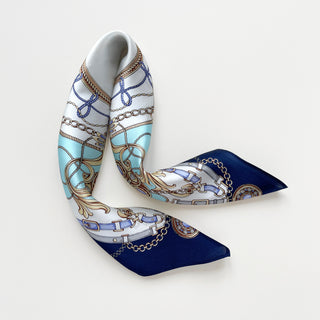 Turquoise & Navy Baroque Bridle Silk Scarf featuring equestrian-inspired design with ornamental chains, buckles, and decorative elements on luxurious silk fabric.
