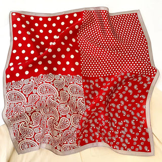 Red silk bandana scarf with four pattern sections - large polka dots, small polka dots, detailed paisley, and simple paisley, with gray trim border