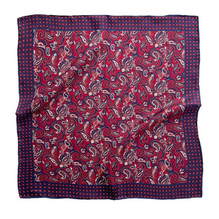 Plum red silk neckerchief with classic paisley pattern in white and navy blue, featuring navy border with small dots and hand-rolled edges