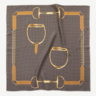 Luxury 65cm square silk scarf with black and beige houndstooth pattern, decorated with gold equestrian-inspired bridle motifs and hand-rolled edges