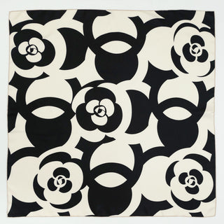 Luxury silk scarf with bold black and white camellia flower pattern, square 90cm design with hand-rolled edges for elegant styling