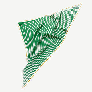 Triangular silk scarf with green and white geometric stripes pattern, featuring elegant hand-rolled gold edges and flowing luxurious fabric texture.