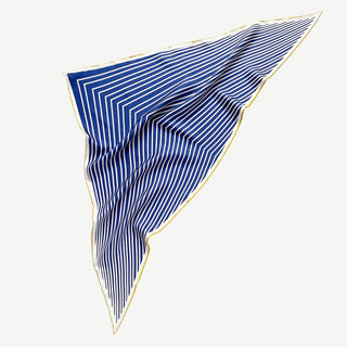 Triangular silk scarf with navy blue and white stripes pattern, featuring elegant gold hand-rolled edges displayed on white background