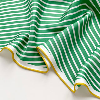 Triangle silk scarf with green and white stripes pattern, featuring elegant yellow hand-rolled edges, showcasing the luxurious fabric texture