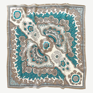 Square silk scarf with intricate baroque pattern in teal blue, cream and brown featuring ornate medallions and paisley designs with decorative border