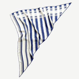 Triangle silk scarf featuring classic blue and white stripes with hand-rolled edges, displaying the luxurious sand-washed finish and soft drape