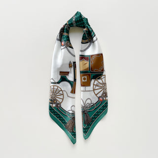 Luxury silk square scarf with emerald green border and white center, featuring vintage equestrian-inspired carriage design with ornate tassels and baroque details