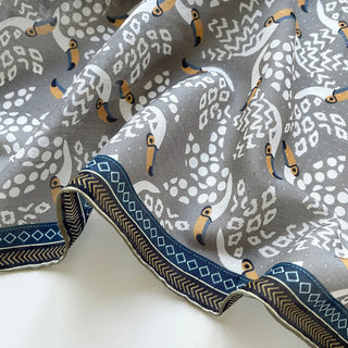 Organic cotton-silk scarf in stone grey with toucan print and understated jacquard texture, featuring contrast border