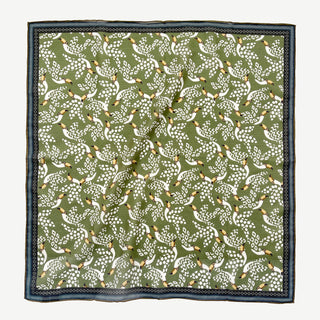 Organic cotton-silk scarf in green with toucan print and understated jacquard texture, featuring contrast border