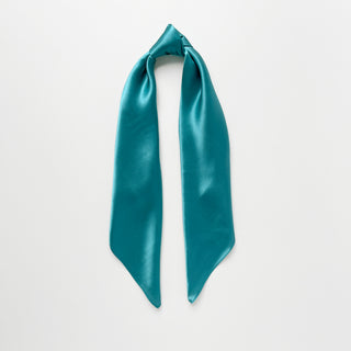 Teal silk satin scarf on a light grey background
