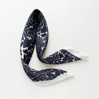 Luxury silk scarf in black floral print with ice white border.