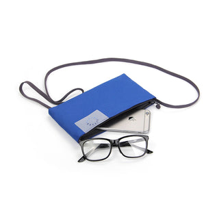Blue crossbody phone wallet with thin black strap, shown partially open with smartphone and glasses displayed beside it