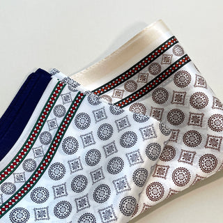 Men's silk neckerchiefs with elegant medal pattern in white, cream, and navy, featuring decorative circular and diamond motifs with red border accents