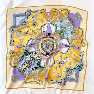 Luxury silk square scarf with ornate vintage pattern featuring yellow and lilac colors, decorative medallion center and intricate border details