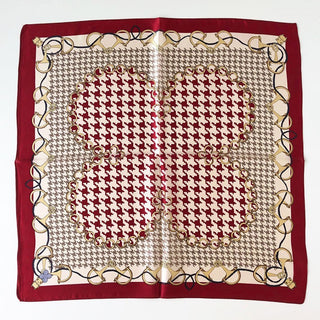 Square silk scarf with burgundy border featuring cream background with houndstooth pattern and decorative chain design around edges