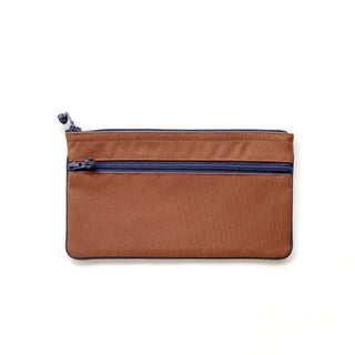 Recycled double zipper wallet in terracotta brown with navy blue zippers and trim, showcasing flat rectangular design with two compartments
