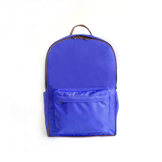 Vibrant blue RPET waterproof backpack with brown piping trim, front zippered pocket, and top carrying handle, displayed on white background
