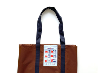 Recycled large tote bag in brown with navy blue straps and Urban Walkers label, featuring icons showing its versatile uses against white background