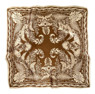 Bronze silk bandana with intricate cream botanical pattern featuring fern and monstera leaves arranged in an elegant symmetrical design