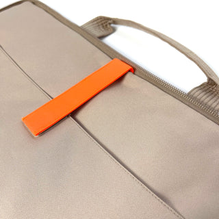 Close-up of beige recycled RPET laptop briefcase with distinctive orange tab accent, showing handle and water-resistant fabric detail